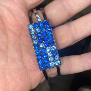 Beautiful blue rhinestone Guess clamper bracelet PM500